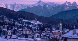 corina d'ampezzo in the winter during a pink sunset