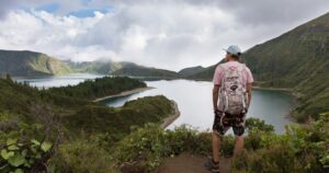 Tourist looking at Lagoa do Fogo in Portugal