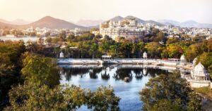 the city of lake in india with a view of lake pichola palace and the mountains
