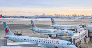 air canada planes lined up at the airport